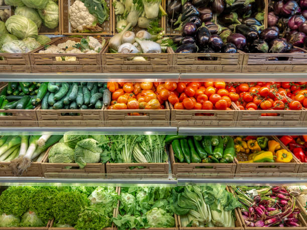 istock Vegetables of various kinds displayed in boxes on shelves 2157826674