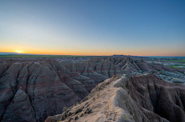 istock Vibrant Sunrise Over Panorama Point's Beautiful Geological Rock Formations in Badlands National Park in South Dakota USA 2157827799