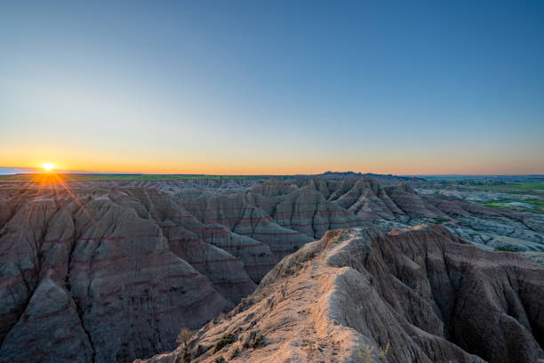 istock Vibrant Sunrise Over Panorama Point's Beautiful Geological Rock Formations in Badlands National Park in South Dakota USA 2157827807