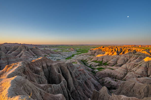 istock Vibrant Sunrise Over Panorama Point's Beautiful Geological Rock Formations in Badlands National Park in South Dakota USA 2157827823