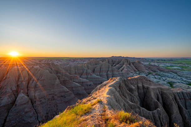 istock Vibrant Sunrise Over Panorama Point's Beautiful Geological Rock Formations in Badlands National Park in South Dakota USA 2157827828