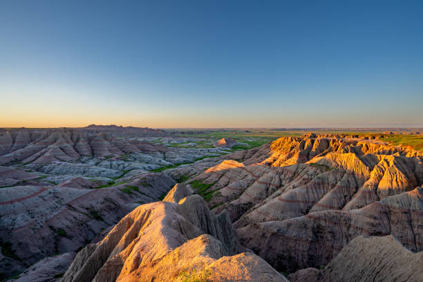 istock Vibrant Sunrise Over Panorama Point's Beautiful Geological Rock Formations in Badlands National Park in South Dakota USA 2157827859