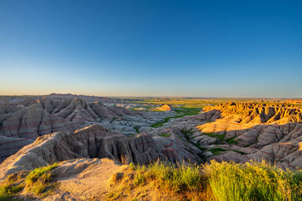 istock Vibrant Sunrise Over Panorama Point's Beautiful Geological Rock Formations in Badlands National Park in South Dakota USA 2157827864