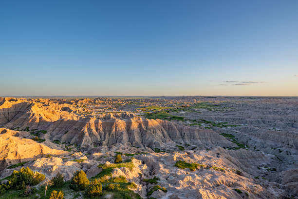 istock Vibrant Sunset Over the Beautiful Geological Rock Formations Around Pinnacles Overlook in Badlands National Park in South Dakota USA 2157828023