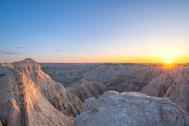 istock Vibrant Sunset Over the Beautiful Geological Rock Formations Around Pinnacles Overlook in Badlands National Park in South Dakota USA 2157828044