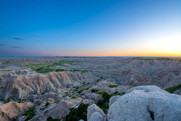 istock Vibrant Sunset Over the Beautiful Geological Rock Formations Around Pinnacles Overlook in Badlands National Park in South Dakota USA 2157828051