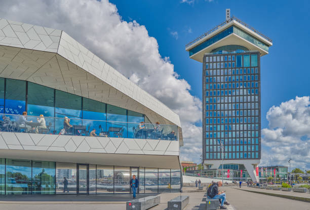 Amsterdam,Holland - August 9, 2023: Side view of the Eye Film museum building with the Adam building in the background
