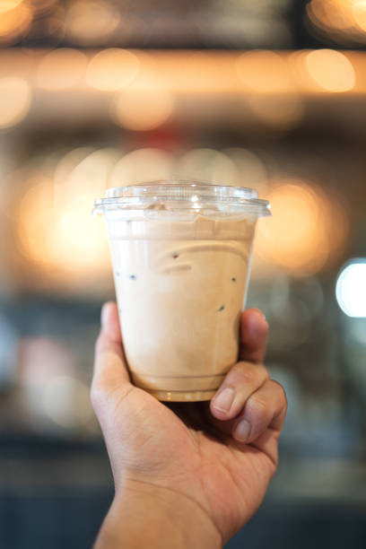 istock An iced milk coffee on hand. 2157829112