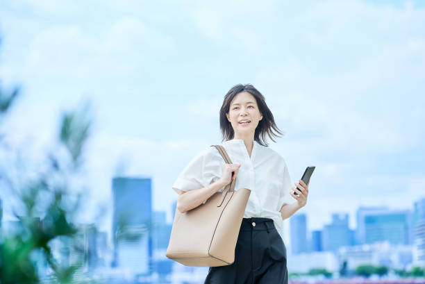 istock A young woman in casual clothes going to work 2157833543