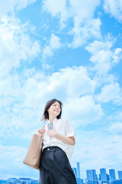 istock A young woman in casual clothes going to work 2157833565
