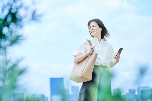istock A young woman in casual clothes going to work 2157833646