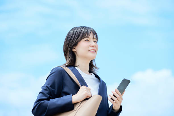 istock A young woman in a suit commuting to work 2157833710