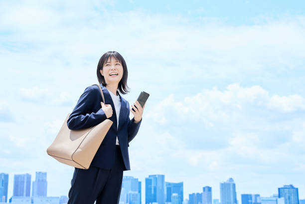 istock A young woman in a suit commuting to work 2157833821