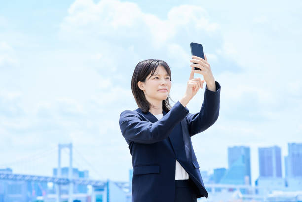 istock A young businesswoman operating a smartphone 2157834539
