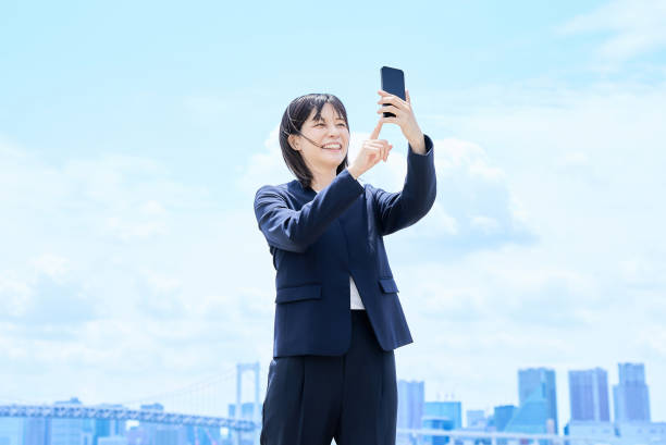 istock A young businesswoman operating a smartphone 2157834590
