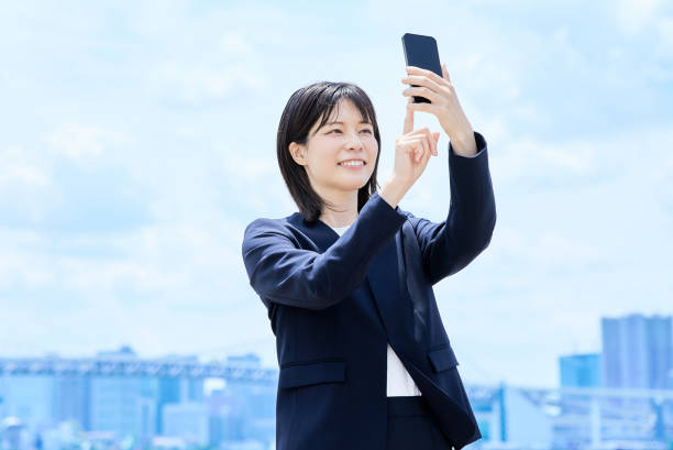 istock A young businesswoman operating a smartphone 2157834596