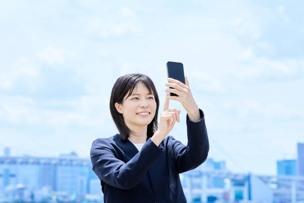 istock A young businesswoman operating a smartphone 2157834618