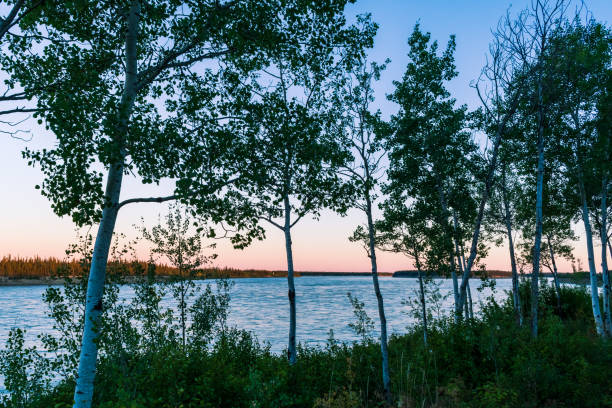 Beautiful orange pink sunset over Mackenzie River near Fort Providence, NT Canada