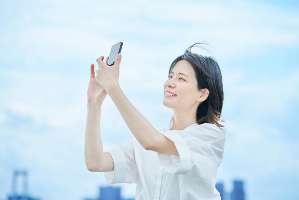 istock A young woman operating a smartphone 2157835138