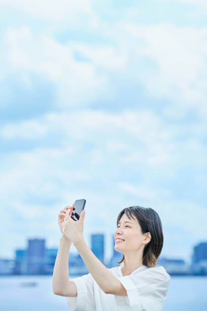 istock A young woman operating a smartphone 2157835178