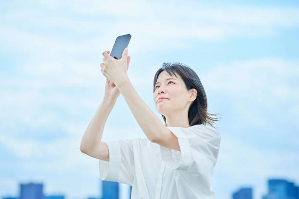 istock A young woman operating a smartphone 2157835196