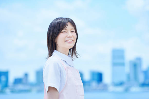 istock A young woman wearing a white coat and apron 2157836167