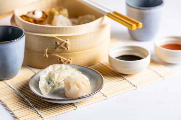 istock Dim sum steamed in a bamboo basket. 2157836617