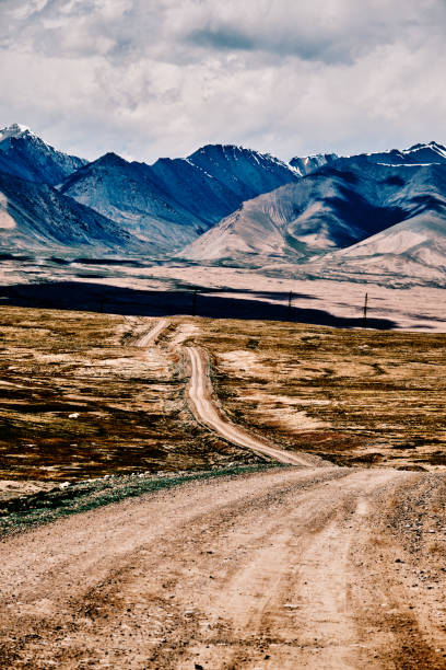 istock Mountain road under moody sky 2157840058