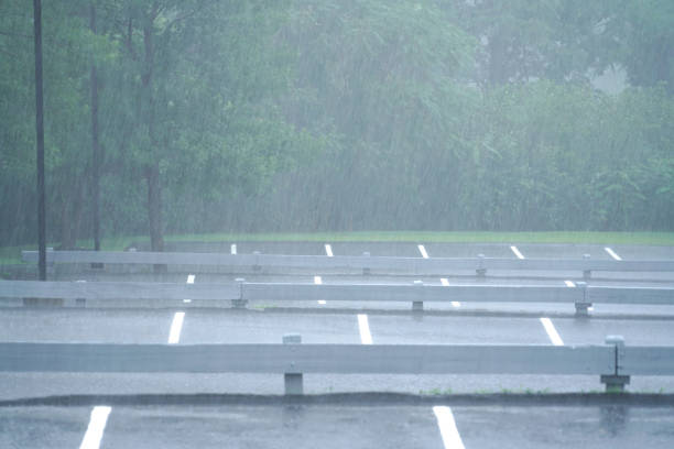 istock parking lot in the heavy rain in summer thunderstorm 2157841771