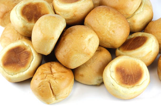 istock close up on fresh baked dinner roll isolated on white background 2157841836