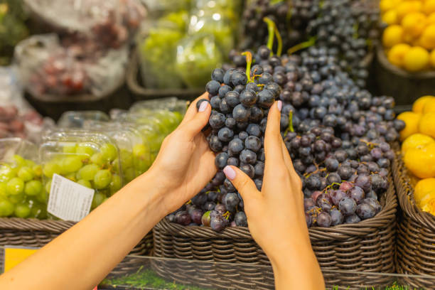 istock Ripe grapes on shelf in store. 2157842069