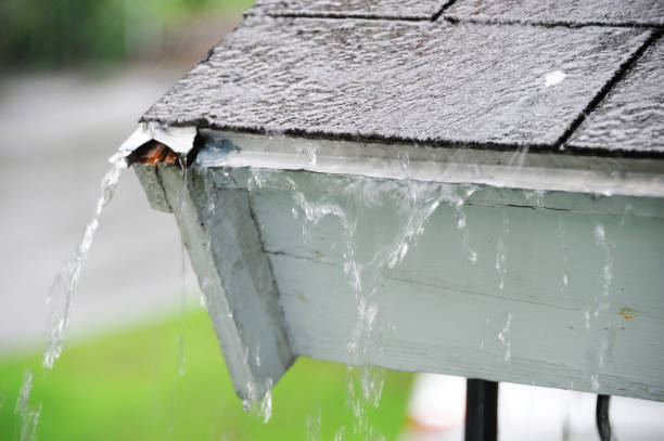 istock close up on rain flowing down the roof 2157843554