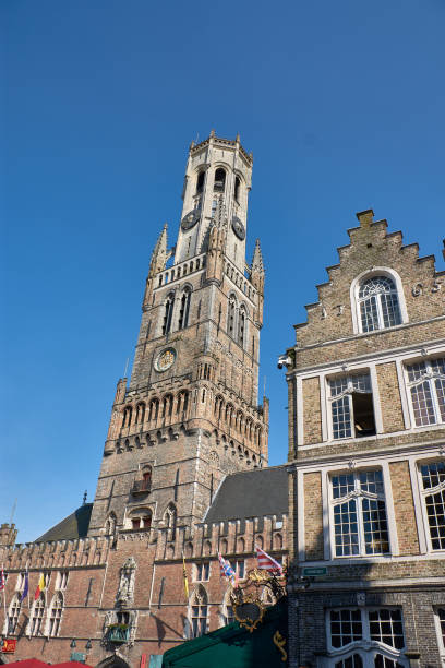 Bruges, Belgium; June,06,2024; The bell tower of a Bruges church, or Belfort, is a medieval alarm tower in the historic center of Bruges, Belgium. One of the most prominent symbols of the city.