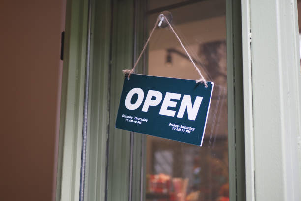 istock Open sign hanging front of cafe . 2157846338