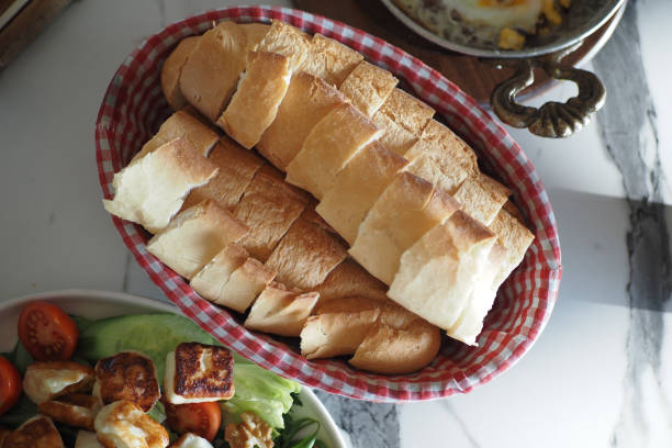 top view of bread rolls rest in a bowl on the table,