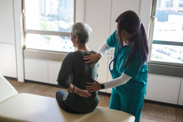 Compassionate Care: Physiotherapist Aids Senior in Recovery