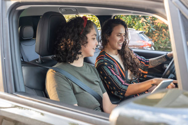 istock Latin women with tablets in the car 2157851888