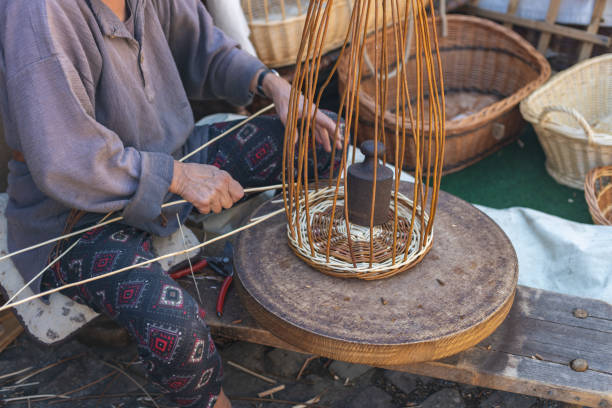 istock An elderly woman weaves a basket by hand. 2157853397