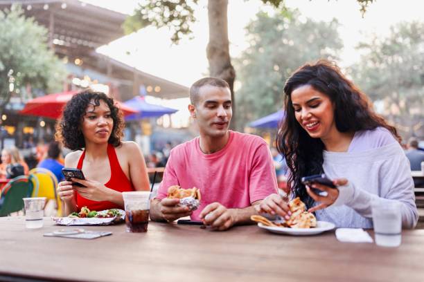 istock Three friends visiting food fair in America 2157857160