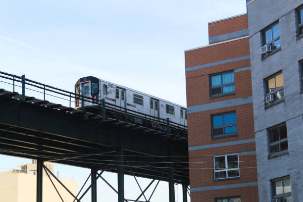 03/15/2022, New York, New York City subway system running on elevated tracks through the city. captures the iconic urban transportation system that defines the bustling streetscape of New York City