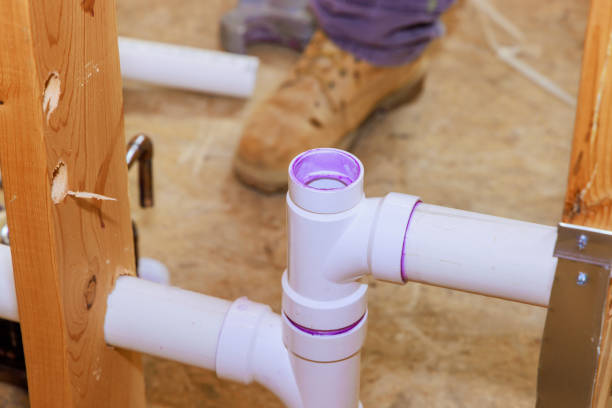 istock Technician plumber using glue is applied to plastic PVC a pipes 2157858206