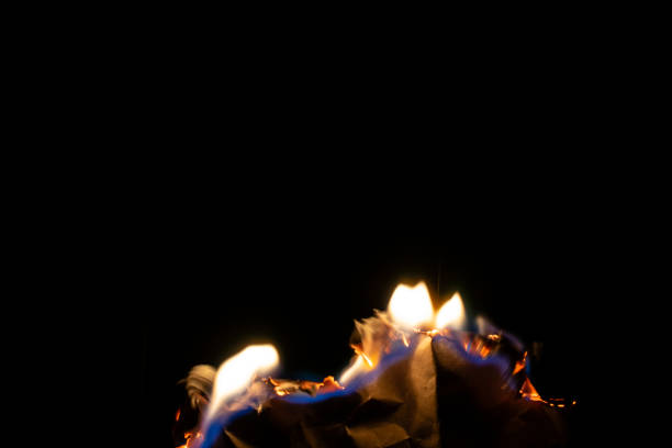 close up view of small burning fire on black backdrop