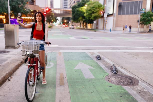 istock Woman on a bike taking a selfie 2157860200