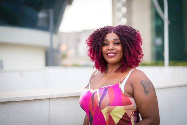istock A smiling young woman at the downtown district 2157860359
