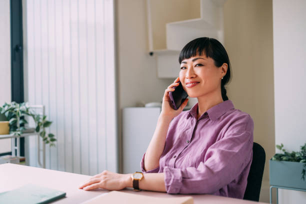 istock Confident Woman On Phone Call At Office Desk 2157872748