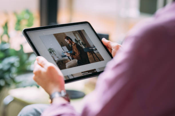 Woman Using Digital Tablet for Remote Work at Home