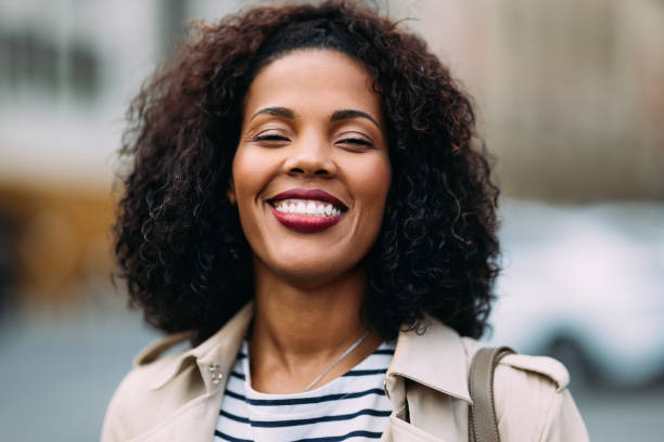 istock Happy Smiling Woman Outdoors in Urban Setting 2157873553