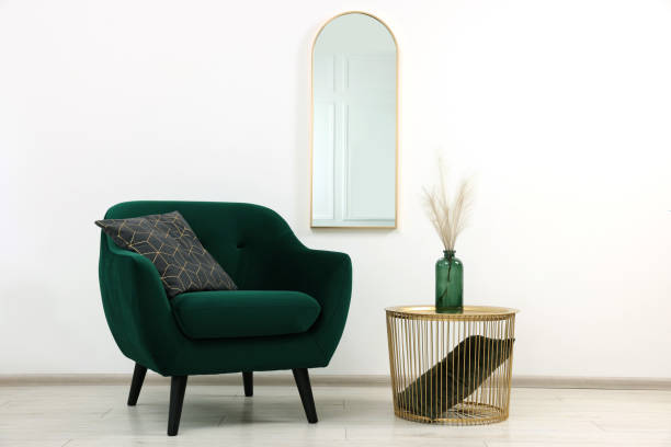 istock Stylish room interior with comfortable armchair and side table 2157876039