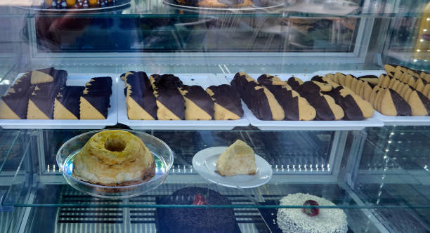 istock Variety of pastries including biscotti and scones in a bakery display 2157876393