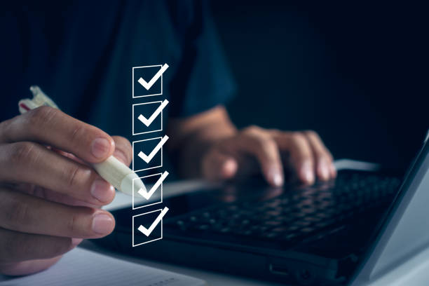 istock Business performance checklist concept. Business people use laptops to take online checklist surveys on virtual screens and fill out digital forms for online exams. 2157876498